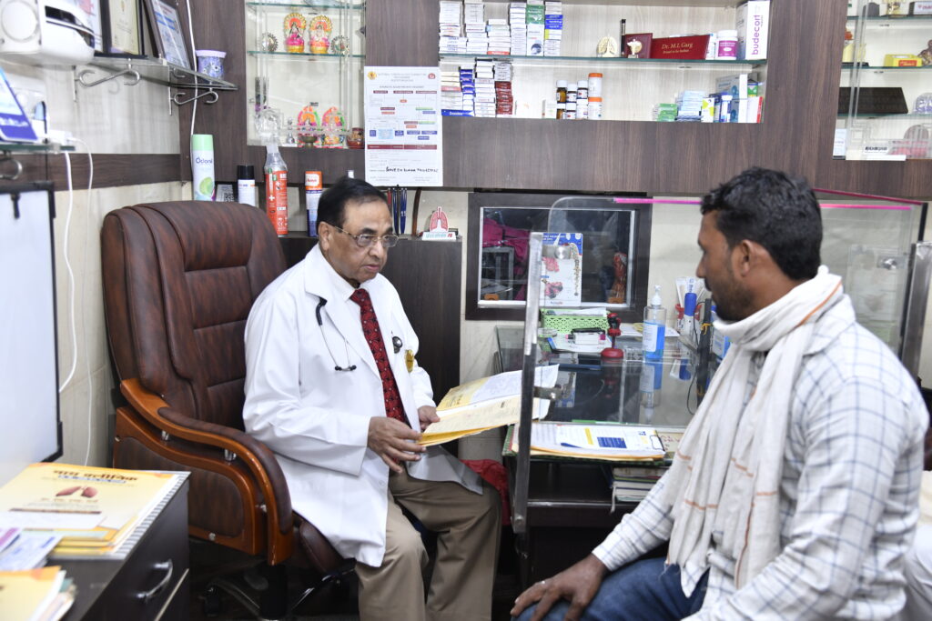 Dr. M.L. Garg treating a patient